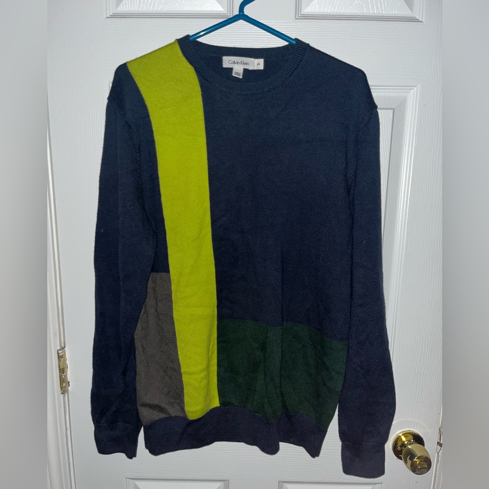 A cute male blue sweater